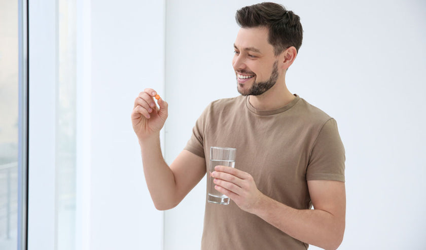 man taking vitamins man taking vitamins